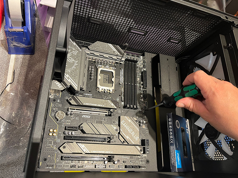 Installing motherboard into PC case for gaming PC build